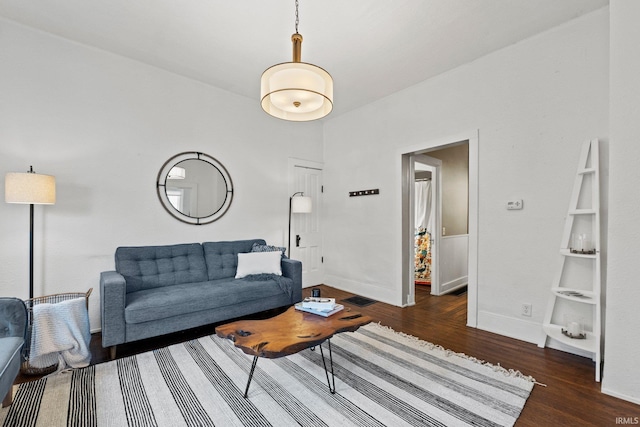 living room with dark wood-type flooring