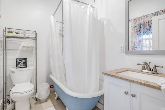 full bathroom featuring tile patterned floors, vanity, toilet, and shower / bath combo