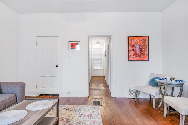 sitting room featuring hardwood / wood-style flooring