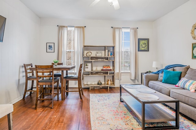 living room with hardwood / wood-style flooring and ceiling fan