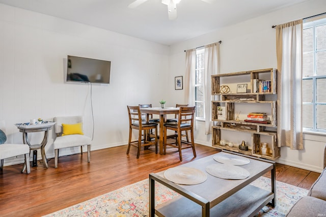 living room featuring hardwood / wood-style floors, plenty of natural light, and ceiling fan