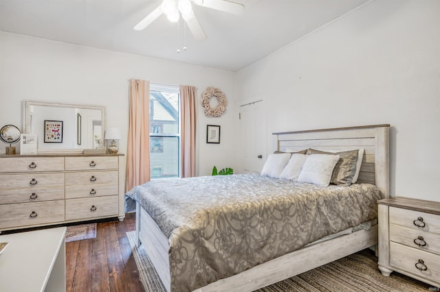 bedroom featuring dark hardwood / wood-style flooring and ceiling fan