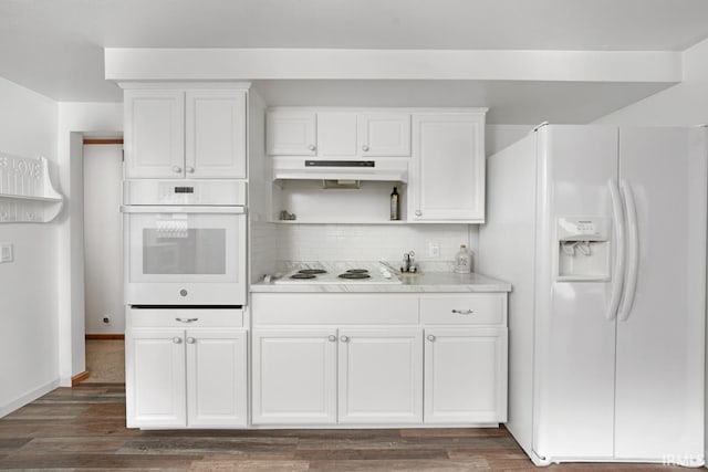 kitchen featuring white cabinetry, backsplash, white appliances, and dark hardwood / wood-style floors