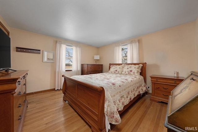 bedroom with light hardwood / wood-style flooring