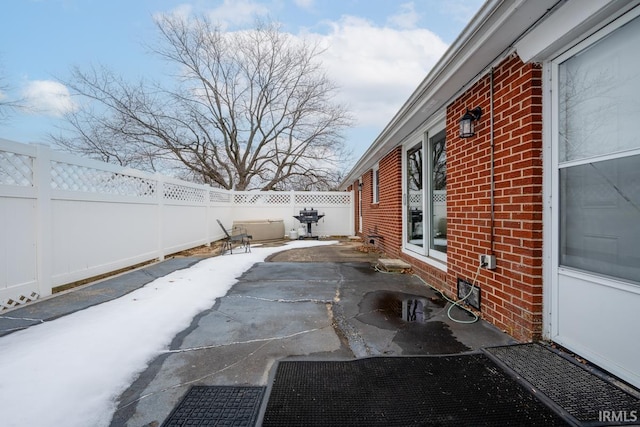 view of patio featuring a grill