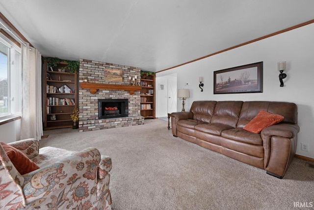 living room featuring built in shelves, light colored carpet, and a fireplace