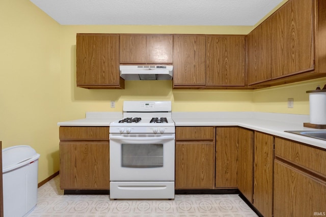 kitchen with white gas stove