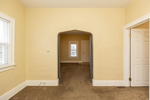 spare room featuring carpet