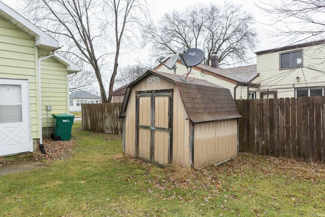 view of outbuilding with a yard