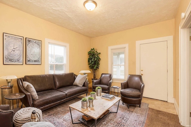 living room featuring plenty of natural light and a textured ceiling