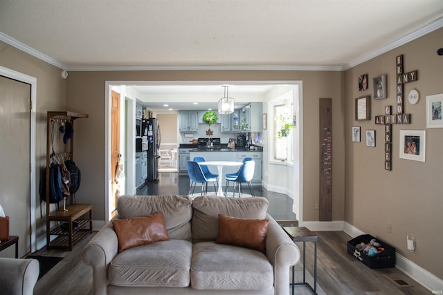 living room featuring ornamental molding and hardwood / wood-style floors