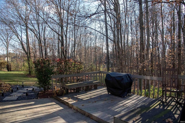 wooden terrace featuring area for grilling