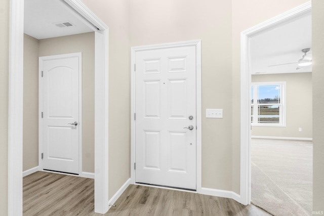 entrance foyer with ceiling fan and light hardwood / wood-style floors