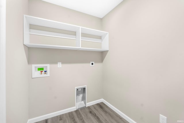 laundry room with electric dryer hookup, hookup for a washing machine, and hardwood / wood-style flooring