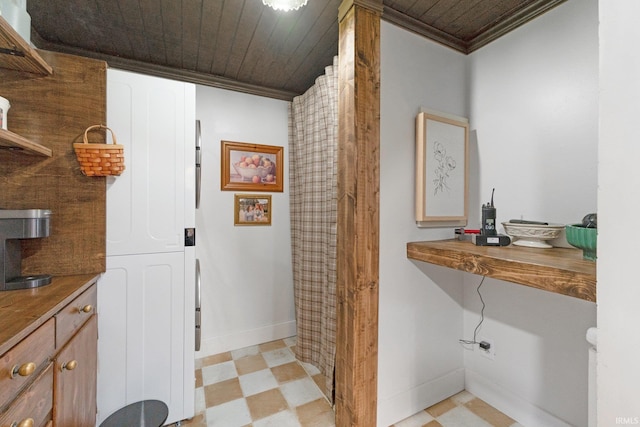 bathroom featuring ornamental molding and wooden ceiling