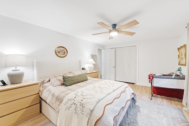 bedroom featuring a closet, ceiling fan, and light hardwood / wood-style flooring