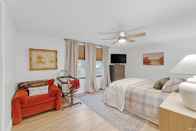 bedroom featuring ceiling fan and light wood-type flooring