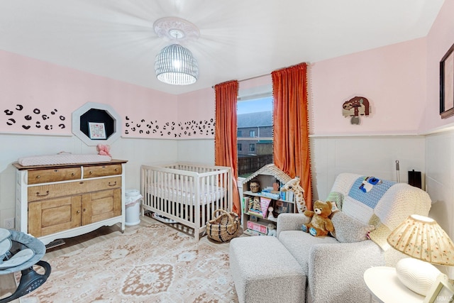 bedroom with a nursery area