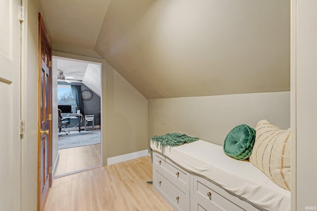 interior space featuring vaulted ceiling and light hardwood / wood-style flooring