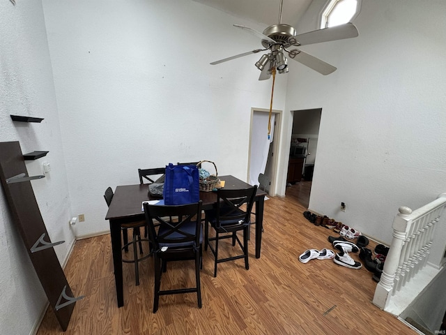 dining area featuring ceiling fan and wood-type flooring