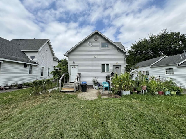 back of house with a yard