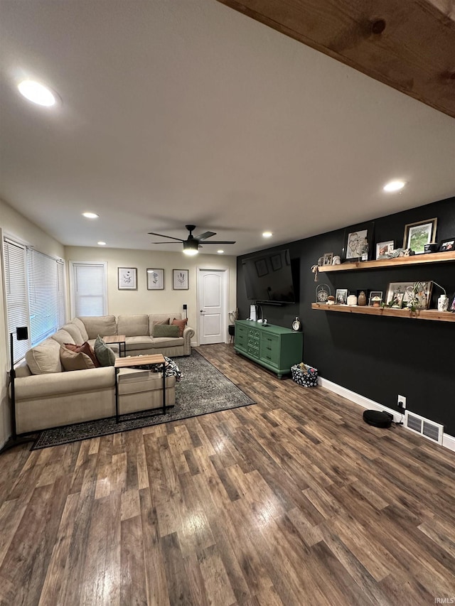 living room with ceiling fan and wood-type flooring