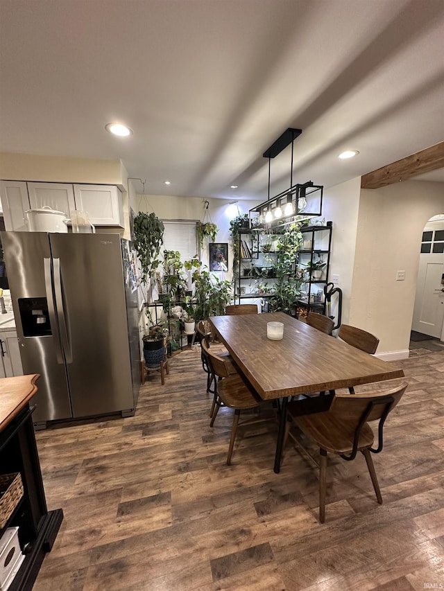 dining area with dark hardwood / wood-style flooring