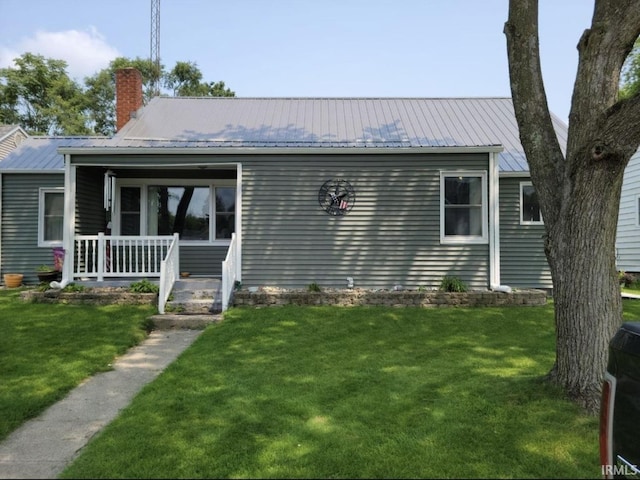 view of front of home with a porch and a front yard