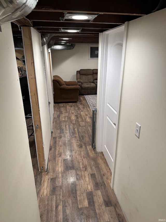 hallway with dark hardwood / wood-style flooring