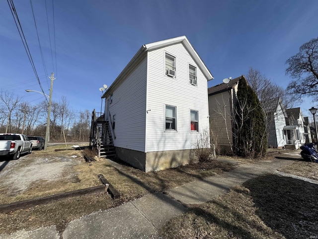 view of property exterior with cooling unit