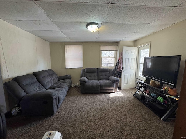 living room with carpet flooring and a drop ceiling