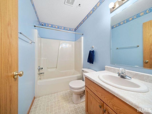 full bathroom with vanity, toilet, a textured ceiling, and shower / bath combination