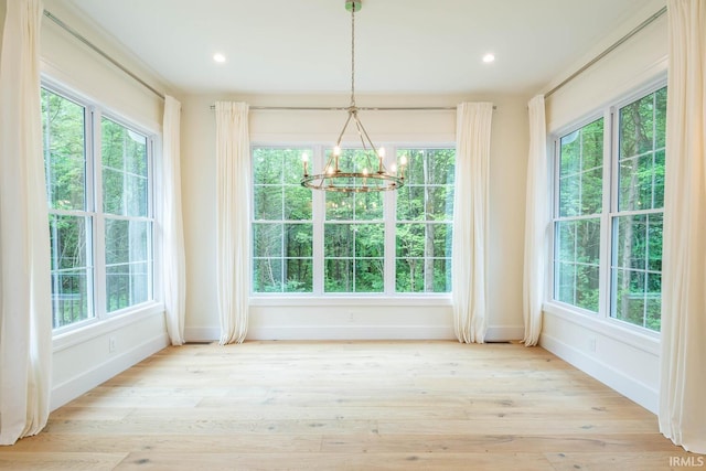 5026 N Muirfield Dr, Bloomington, IN 47404 - unfurnished sunroom featuring a wealth of natural light and a chandelier