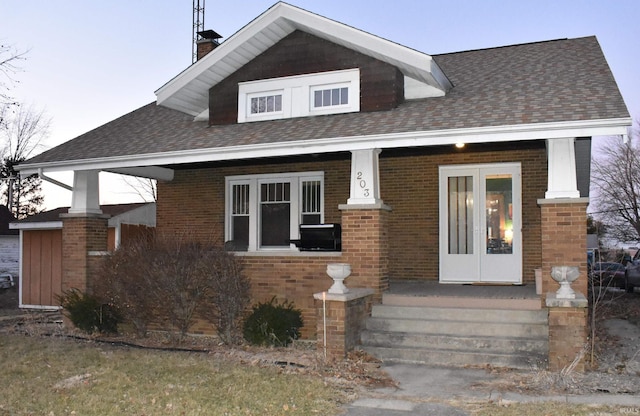 view of front facade featuring french doors and a porch