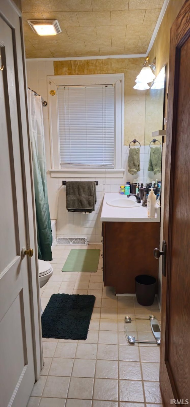 bathroom with vanity, tile patterned flooring, a shower with curtain, and toilet