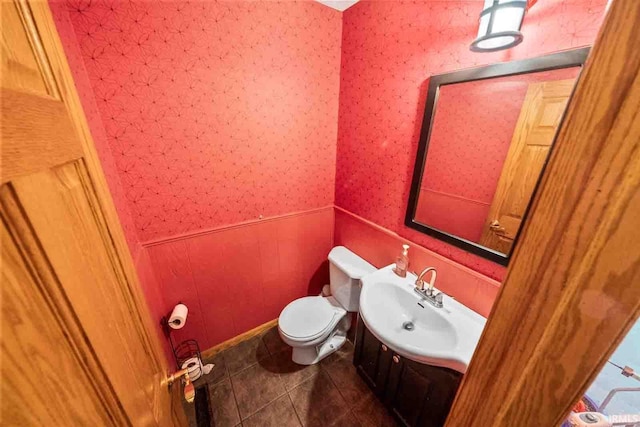 bathroom with vanity, tile patterned floors, and toilet