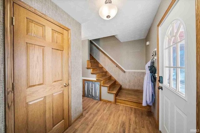 foyer entrance with light hardwood / wood-style flooring