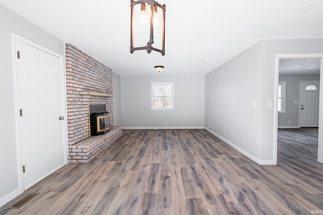 unfurnished living room featuring dark hardwood / wood-style floors