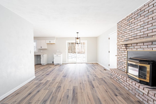 unfurnished living room featuring light hardwood / wood-style floors