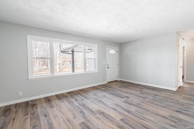 entryway with hardwood / wood-style floors