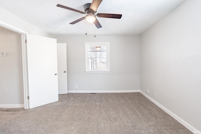 carpeted empty room with ceiling fan