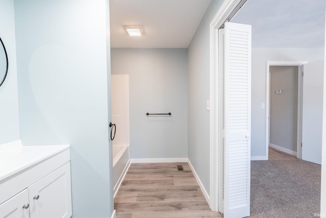 bathroom with vanity and hardwood / wood-style floors