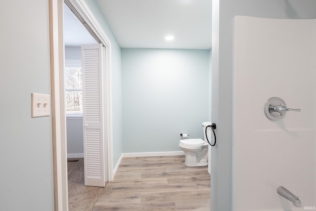 bathroom featuring hardwood / wood-style floors and toilet