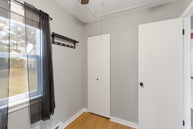 interior space featuring a closet, ceiling fan, and light wood-type flooring