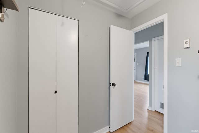 unfurnished bedroom featuring light hardwood / wood-style floors and a closet