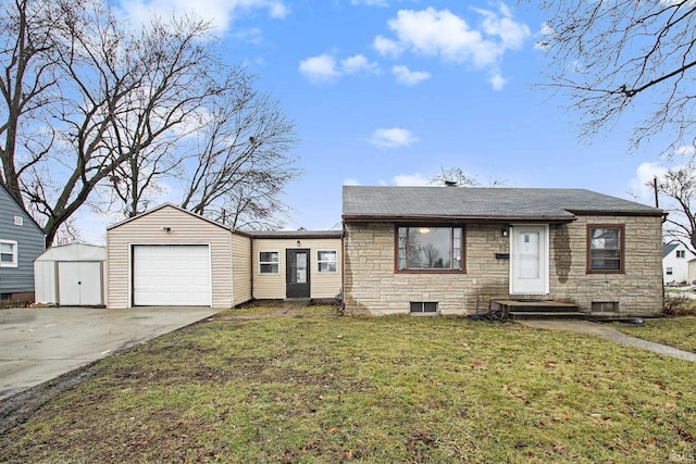 view of front of property featuring a storage shed, a front yard, and a garage