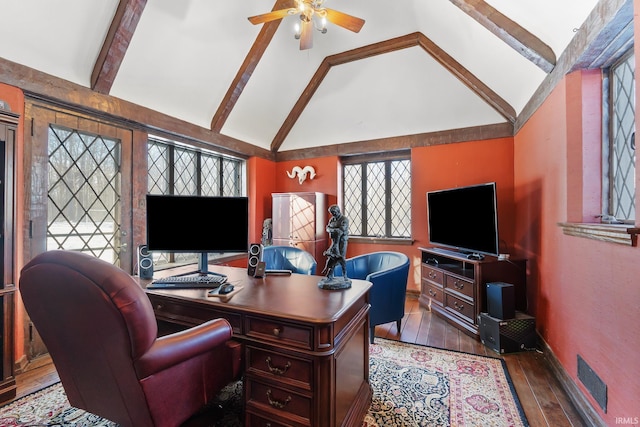 home office featuring dark wood-type flooring, ceiling fan, and lofted ceiling with beams