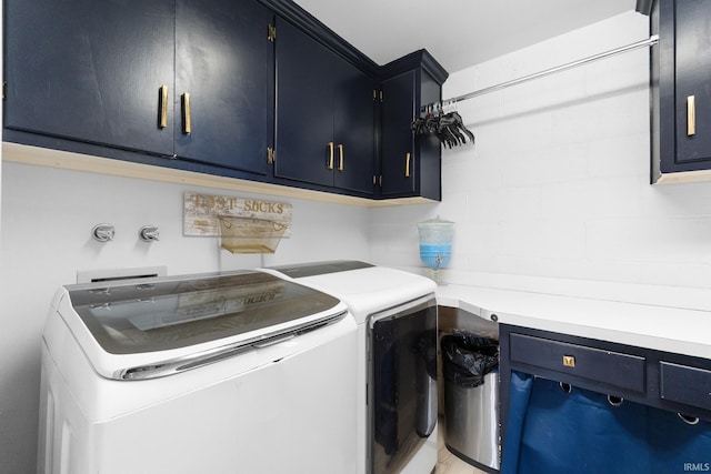 laundry area with cabinets and washer and dryer