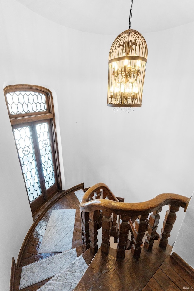 dining area with an inviting chandelier and wood-type flooring