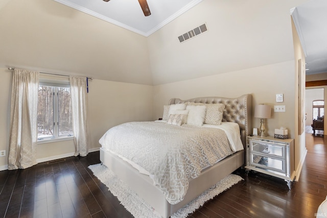 bedroom featuring crown molding, lofted ceiling, dark wood-type flooring, and ceiling fan